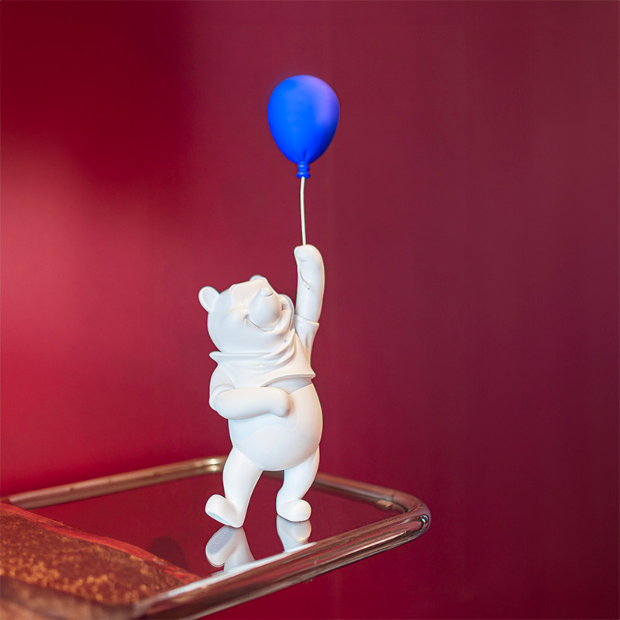 Winnie the Pooh Balloon Sculpture with a Colbalt Blue Balloon